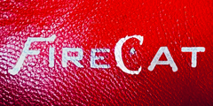 The FireCat logo: Red textured background, silvery white text. Serrahna.com