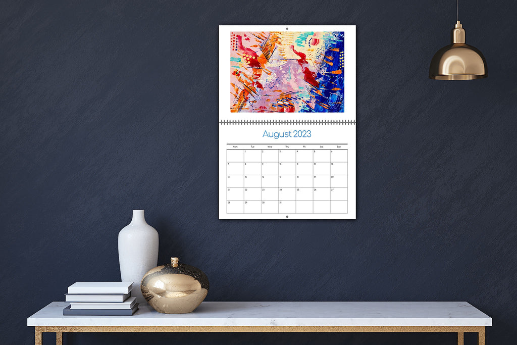 The Artfully Abstract Calendar 2023, displayed on a wall.