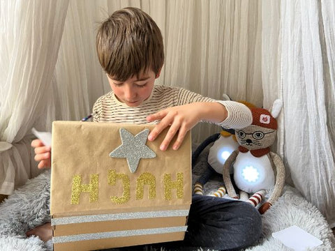 Boy using worry box with Brave and Able