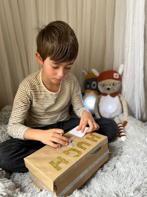 Boy using worry box with Brave and Able