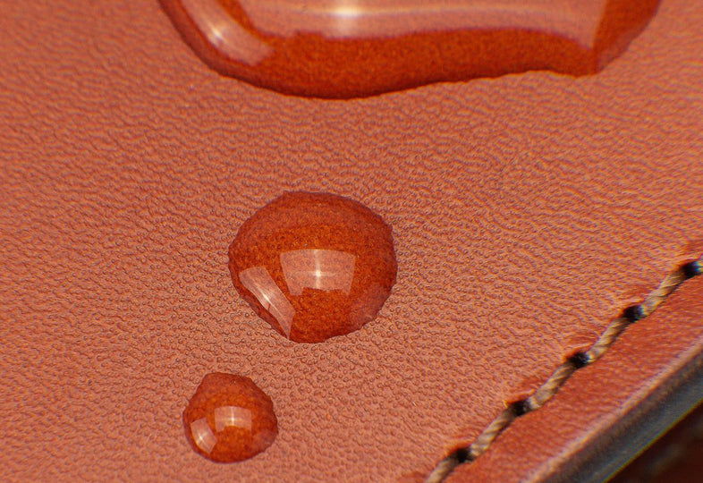 Water drops on brown leather