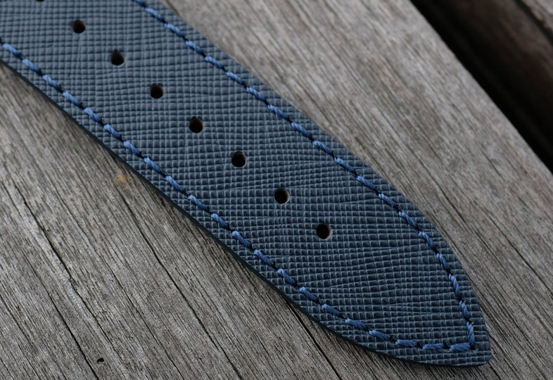 Blue Saffiano leather watch strap on wooden bench