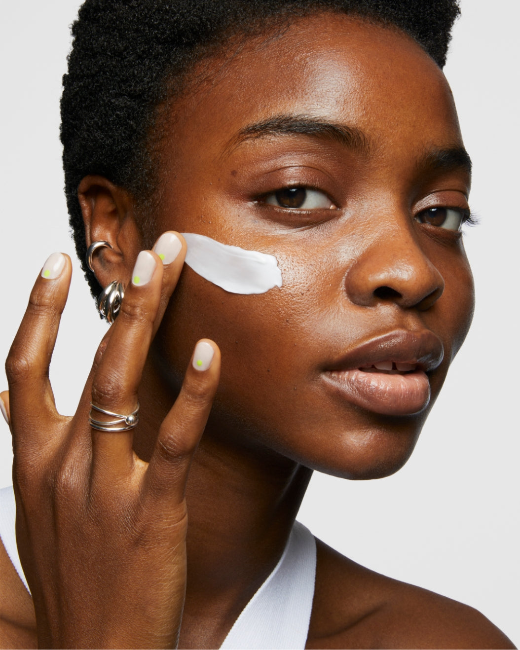 Photo of a model wearing Milk Makeup Products against a white background