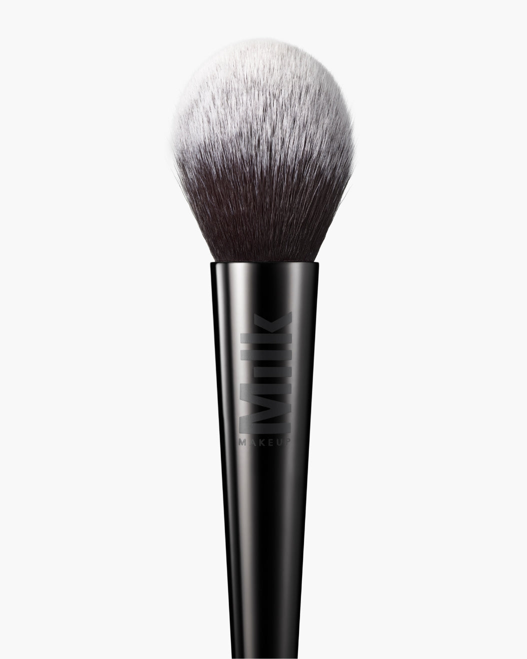 Close-up shot of the Milk Makeup Pore Eclipse Powder Brush against a white background.