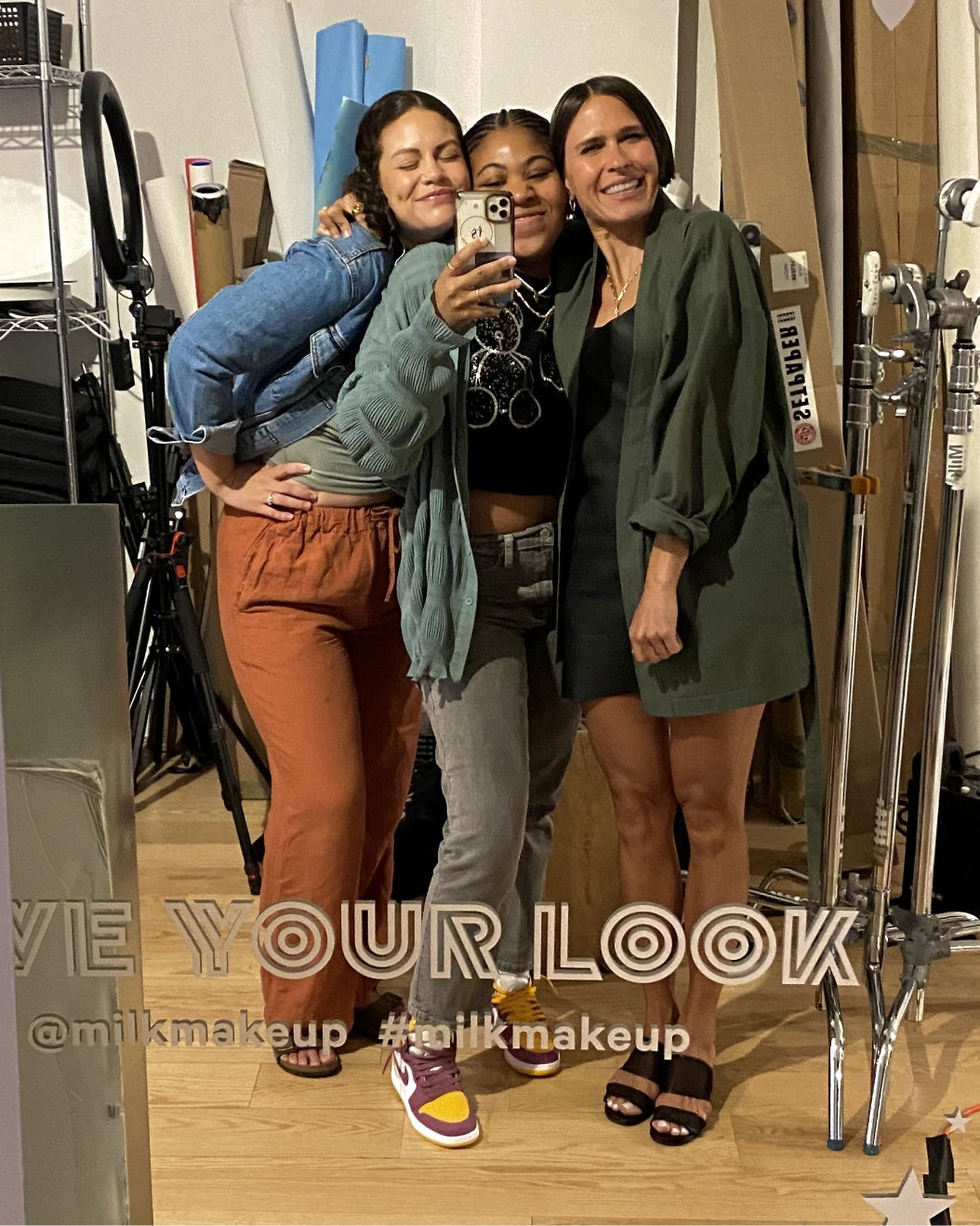 Mirror selfie of three Milk Makeup staffers