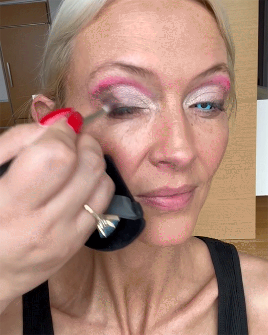Milk Makeup cofounder Zanna Roberts-Rassi gets her brows filled in and eyeshadow applied by a makeup artist
