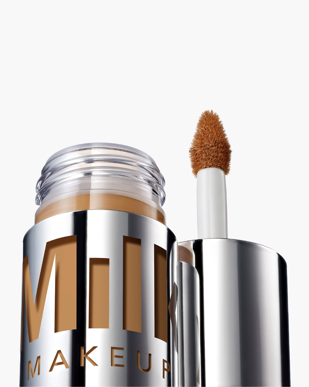 Product shot of a bottle of Milk Makeup Future Fluid All Over Cream Concealer against a white background.