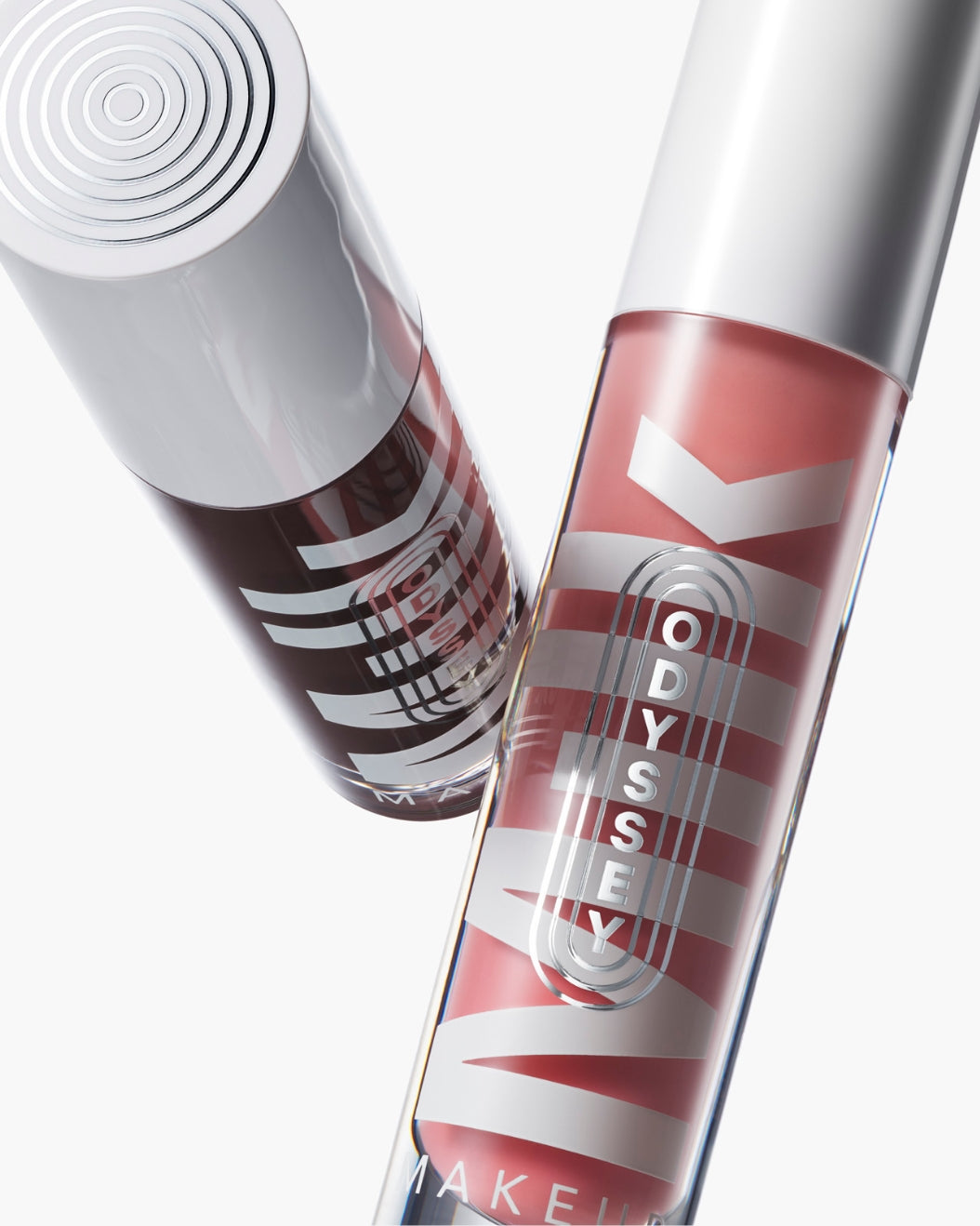 Flying tubes of Milk Makeup Odyssey Lip Oil Gloss on a white background
