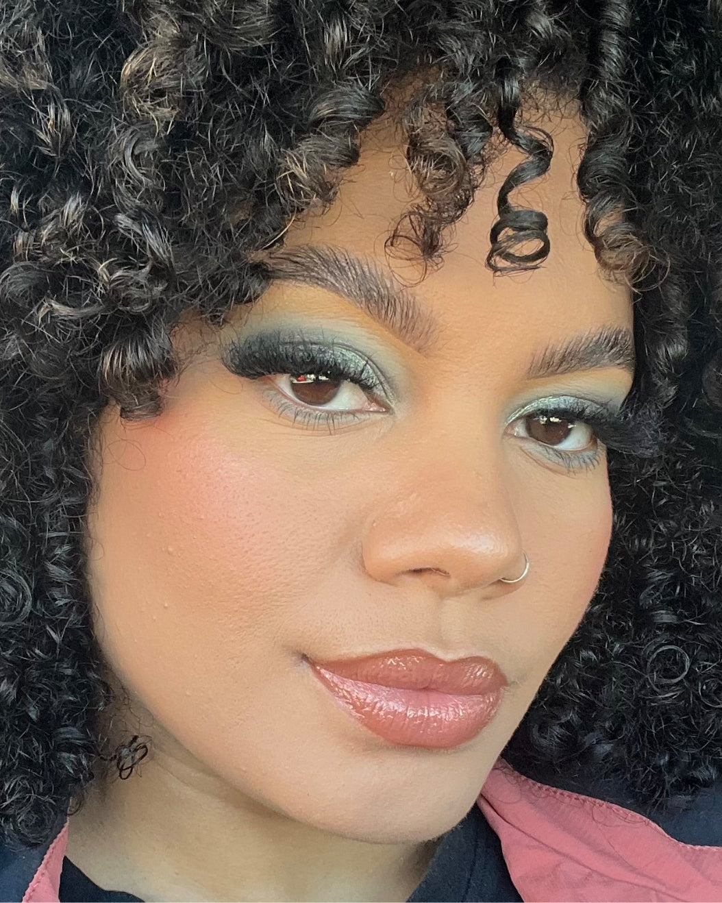 Makeup artist wears a matcha latte-inspired makeup look with light khaki-colored matte eyeshadow.