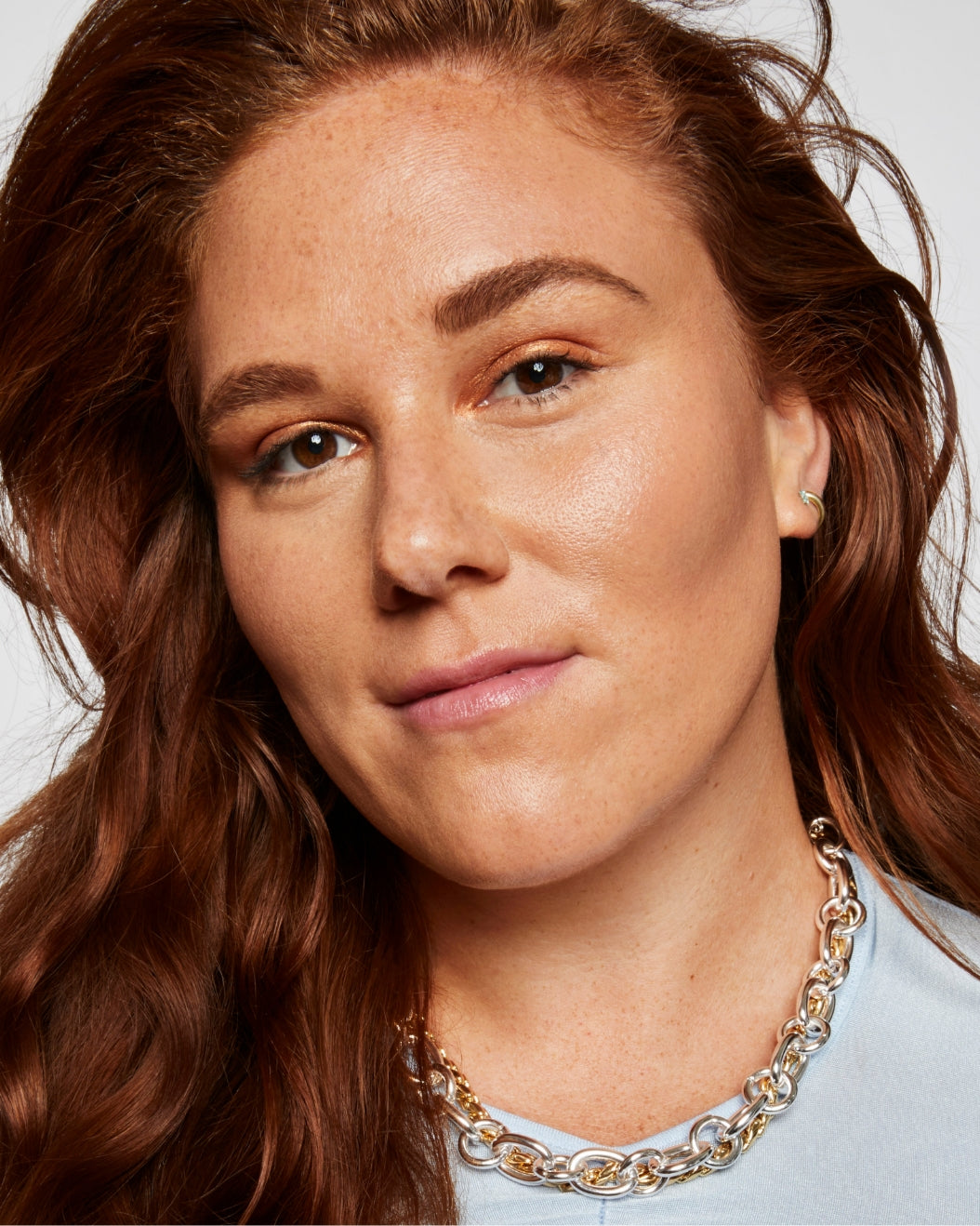  Model wears a full face of Milk Makeup products including Sculpt Stick, Matte Bronzer, and Lip + Cheek on a white background.