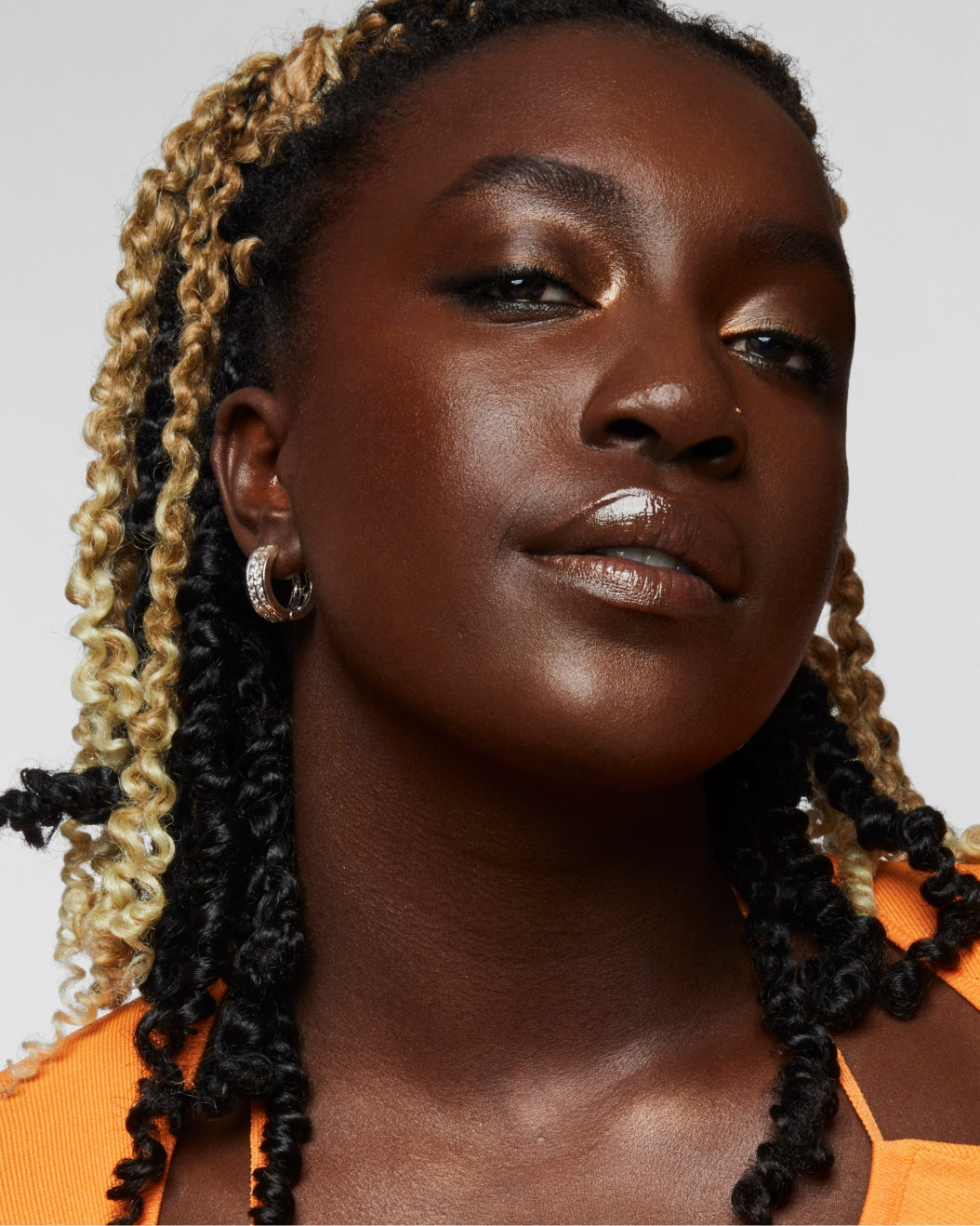 Model Wears Milk Makeup Matte Bronzer on cheeks against a white background