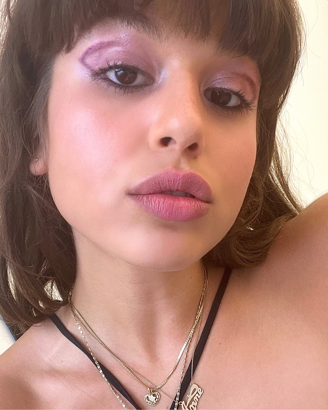 Rebecca wears Milk Makeup Color Chalk in Bounce for a purple eye look