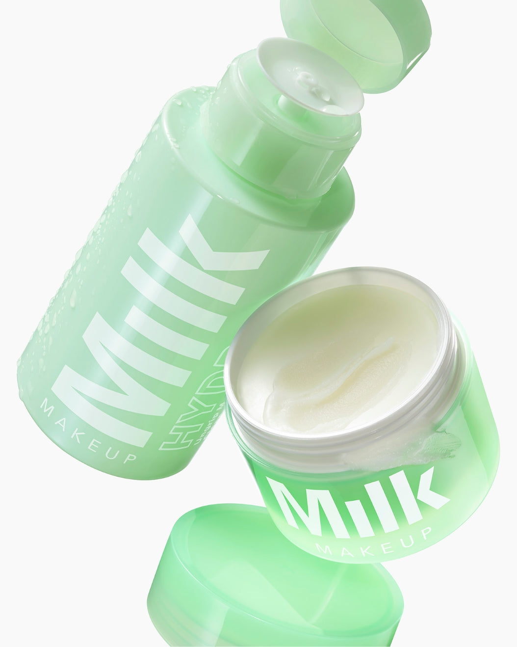 Image of flying bottles of Milk Makeup Hydro Ungrip Cleansing Balm and Hydro Ungrip Makeup Remover + Cleansing Water on a white background