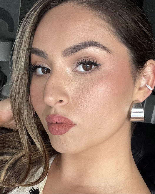 Model wears a neutral glam makeup look you can wear to a wedding.