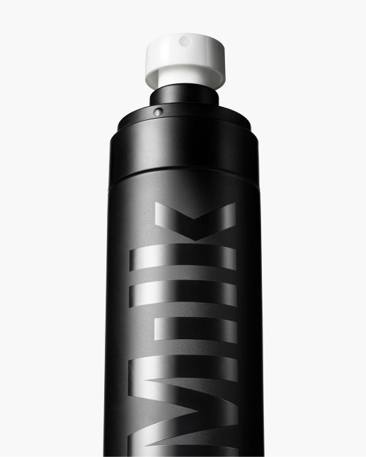 Shot of Milk Makeup Pore Eclipse Matte Setting Spray against a white background.