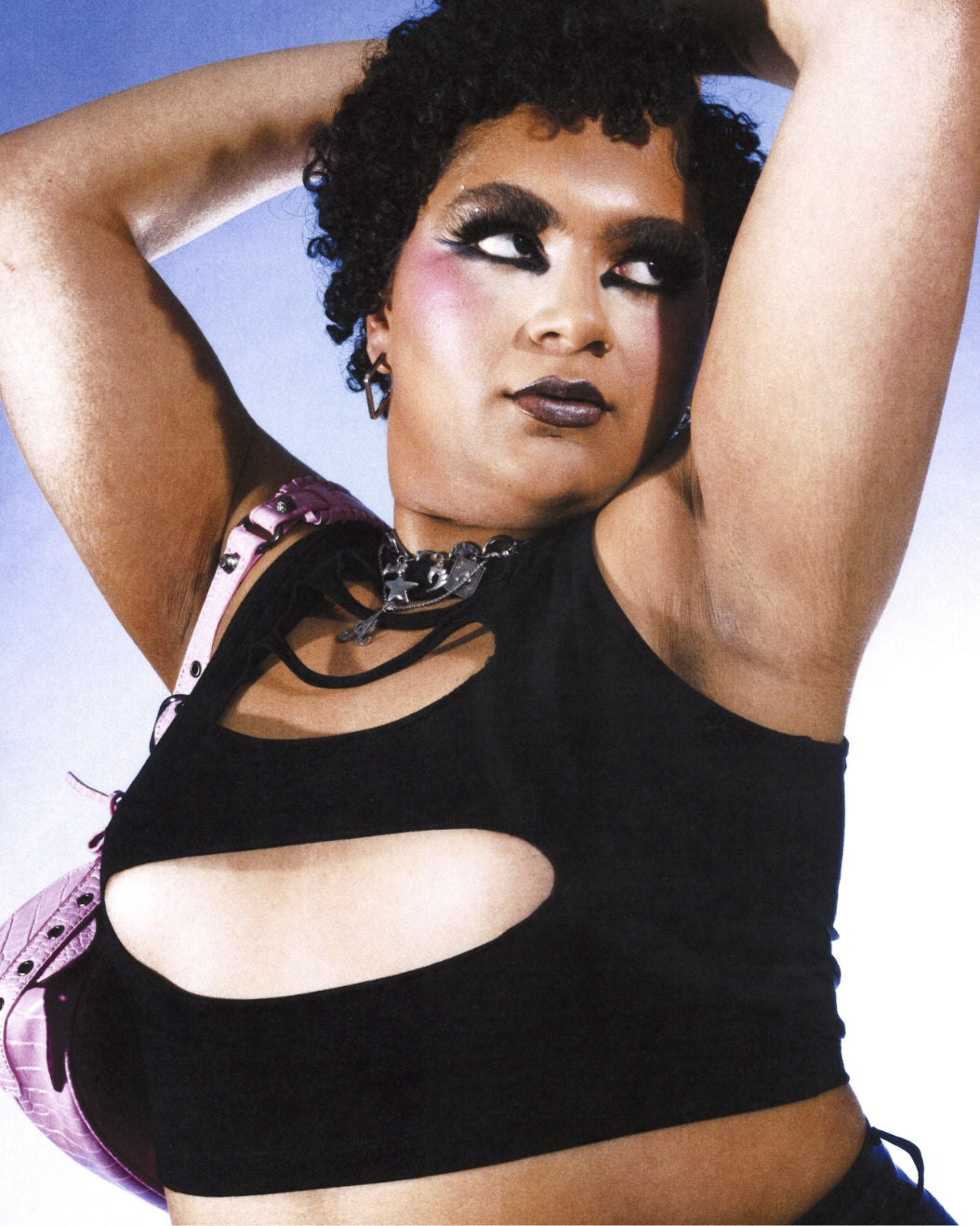 Haus of Telfar member Arie "Rose" poses against purple background