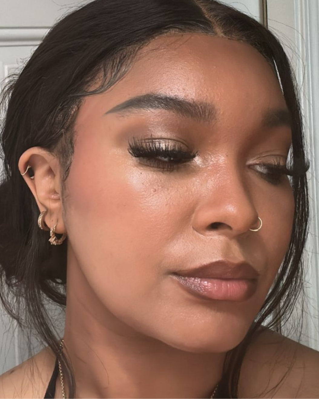 Person wearing neutral brown smoky eye wedding makeup