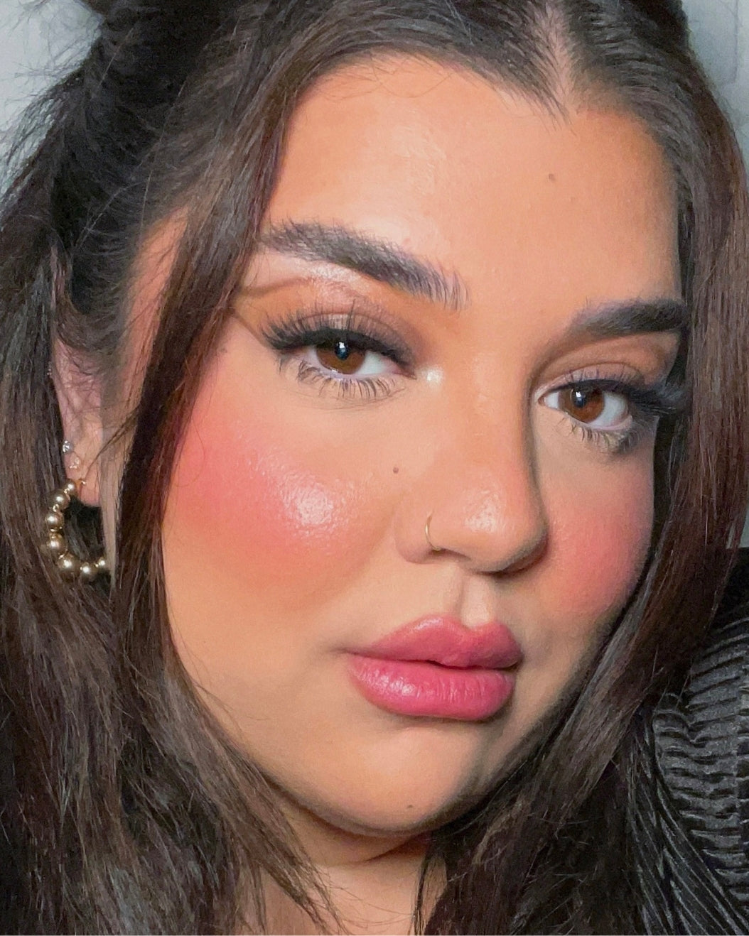 Selfie of a person with a light-medium skin tone wearing Milk Makeup Lip + Cheek in Quickie