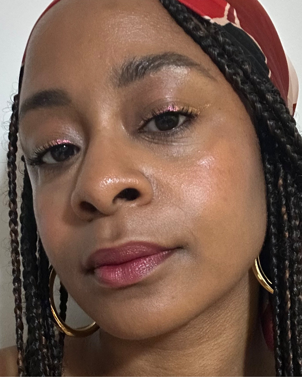 Selfie of a woman with a medium-deep skin tone wearing Milk Makeup Lip + Cheek in Quickie