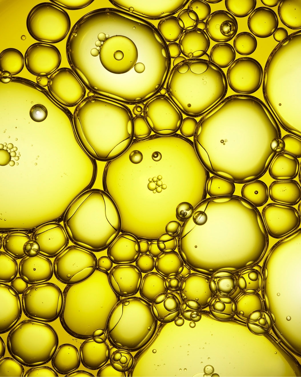 Close-up image of a bunch of yellow oil bubbles
