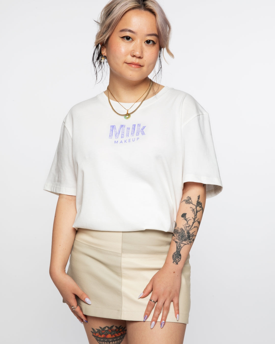 Iley wearing Milk Makeup x Joe Perez Merch Collab white t-shirt