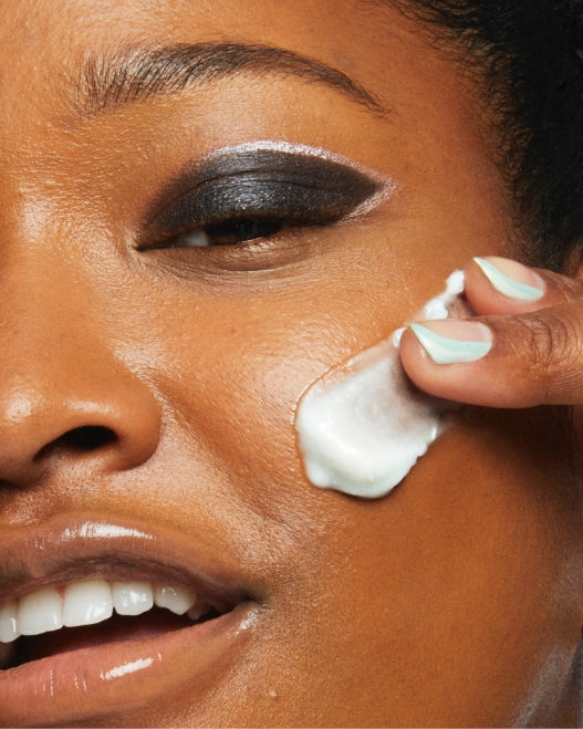 Imani Randolph applying Milk Makeup Hydro Ungrip Makeup Removing Cleansing Balm to face