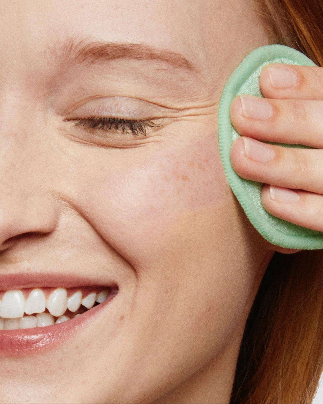 Close up of model removing foundation with Hydro Ungrip Makeup Remover + Cleansing Water