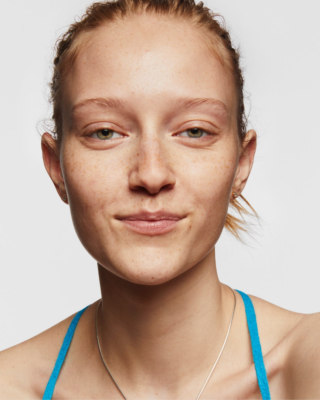 Portrait of a smiling model with no makeup