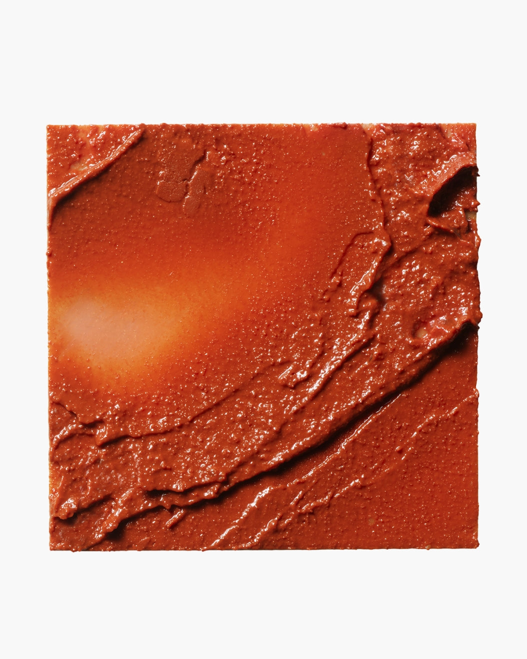 Close-up image of Milk Makeup Lip + Cheek texture in terracotta