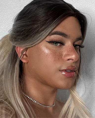 Content creator wears Milk Makeup Hydro Grip Set + Refresh Spray for a dewy glow