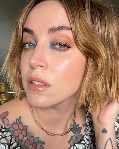 Content creator wears Milk Makeup Color Chalk for a pop of color