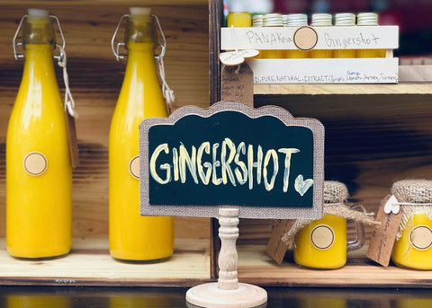 Bottles of ginger elixir on display at craft market