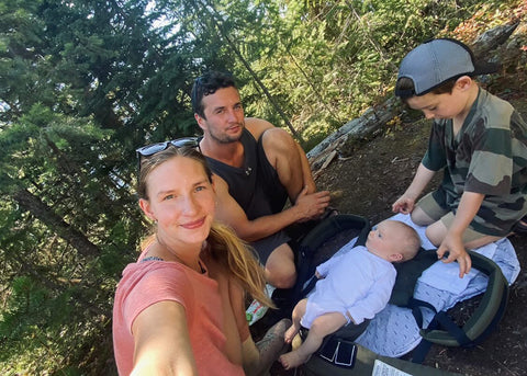 young outdoor couple with thei toddler and baby 