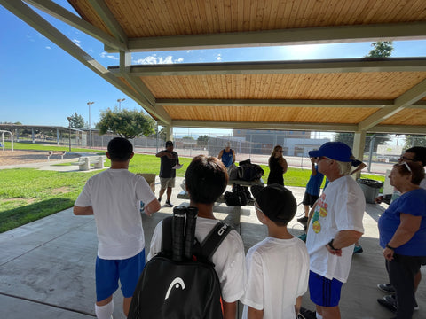 USTA officials explaining the rules of the tournament to all the players.