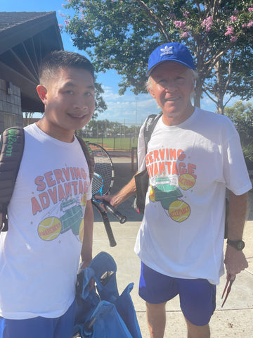 Serving Advantage doubles team Evan Eusebio and Marty Junor smiling as they get ready to enter the tennis courts.