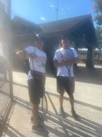 Serving Advantage doubles team Jacob Cid and Wilson Collas smiling as they get ready to enter the tennis courts.