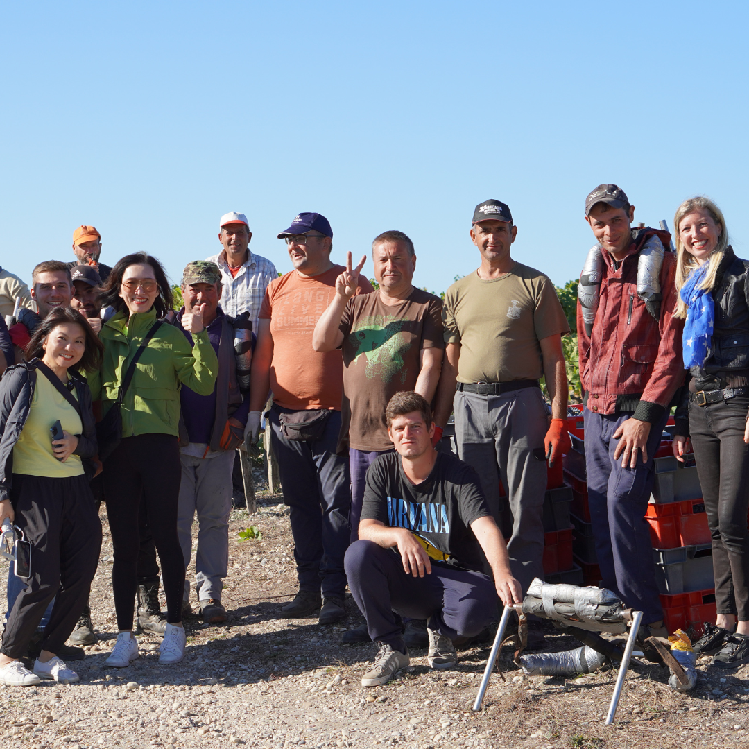 Group photo with the owner and staff in vineyards