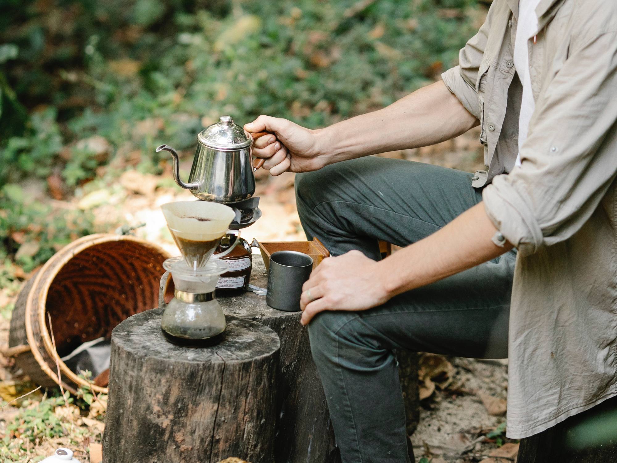 Person making coffee in the garden