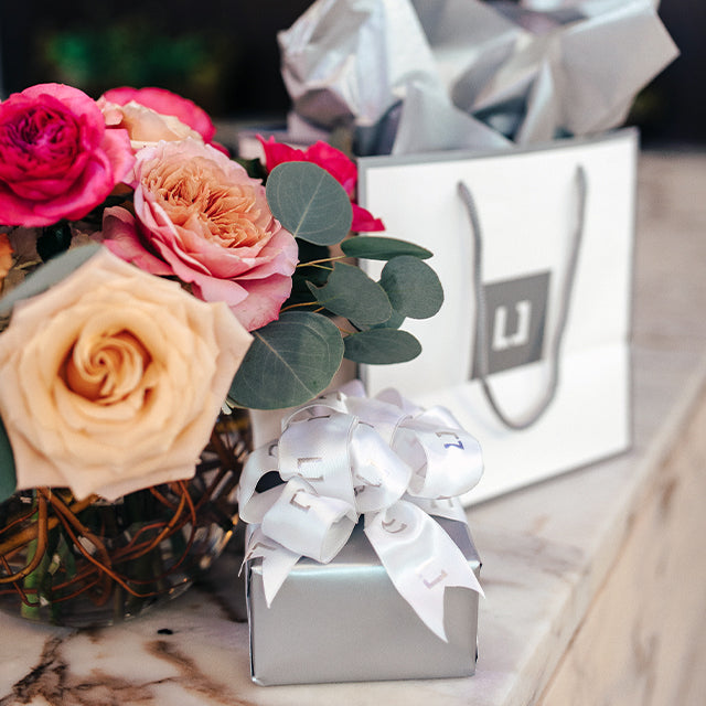 Lewis Jewelers gift bags with roses