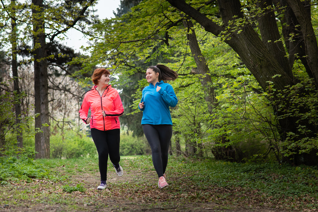 Two women jogging in the park 