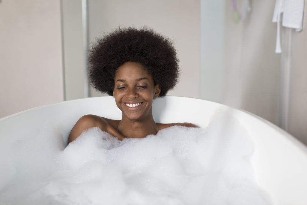 Woman relaxing in a bubble bath