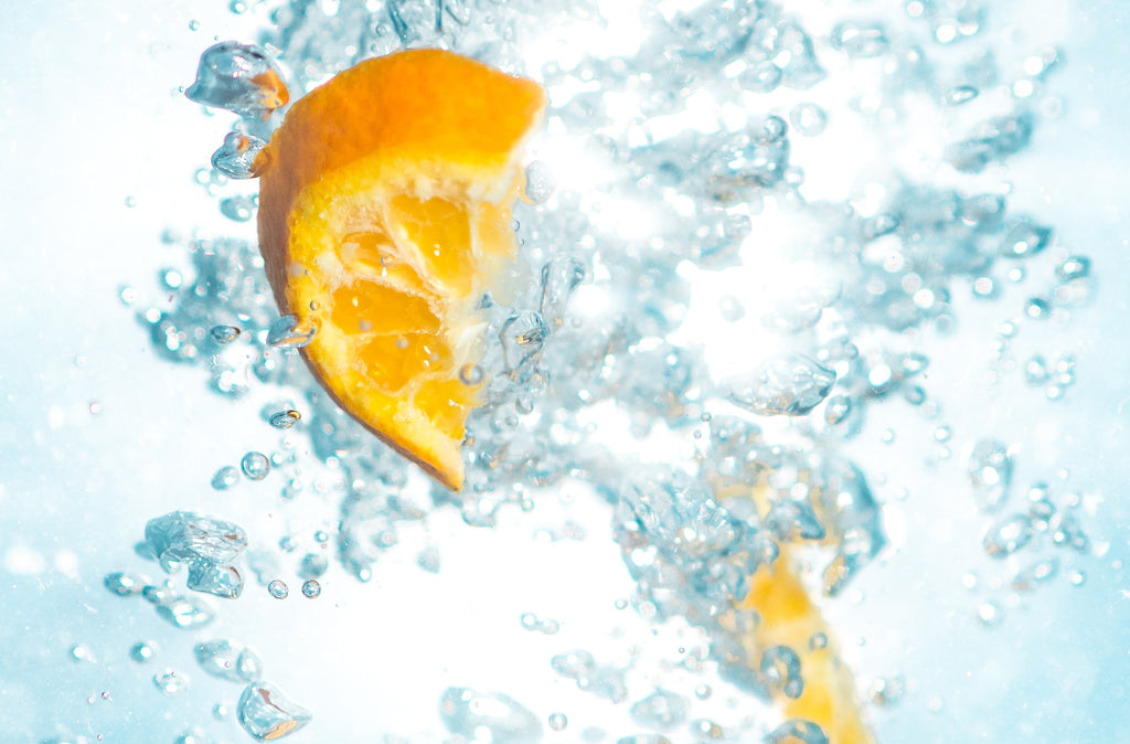 Orange segments in sparkling water