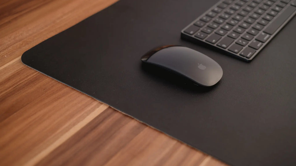 black magic mouse on mousepad