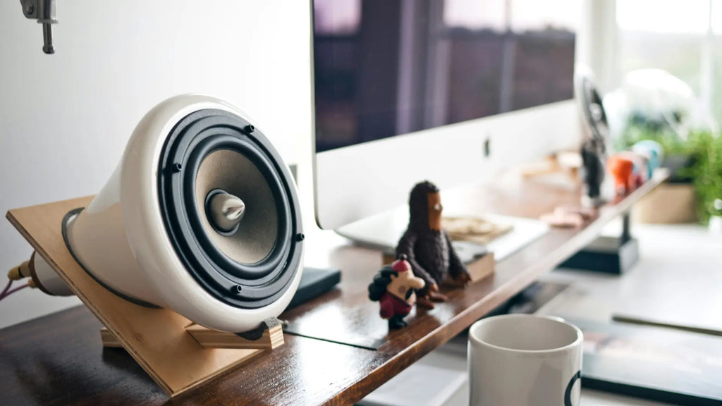 imac with speaker system on a desk