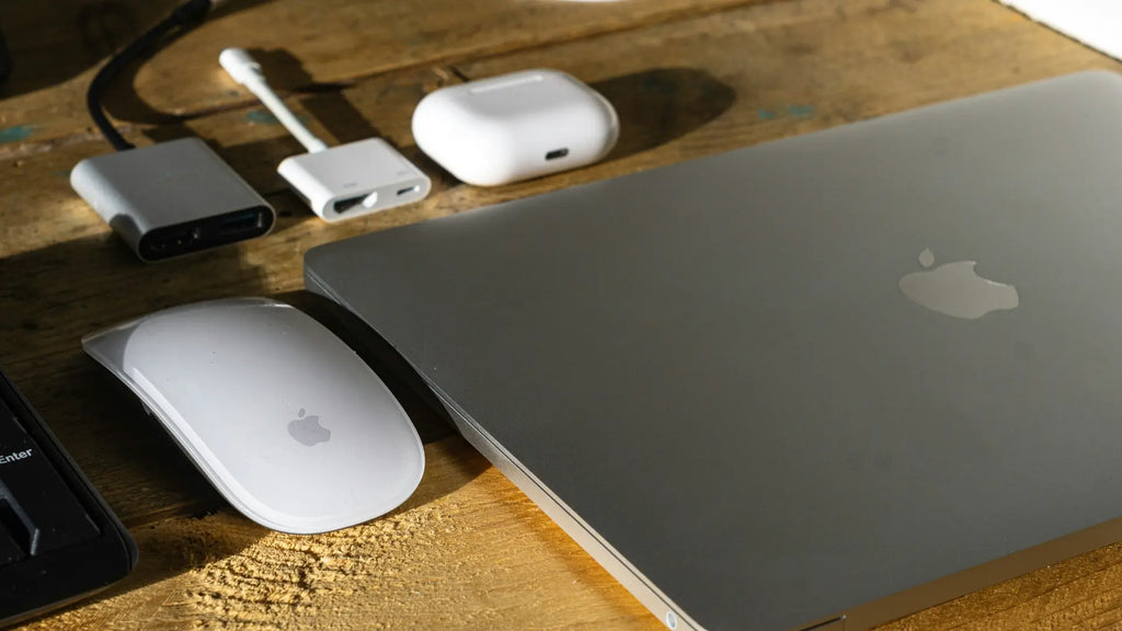 macbook, magic mouse and different cables