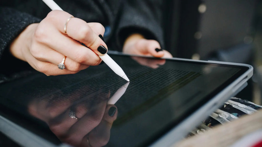 person using the apple pencil for ipad