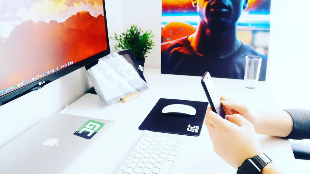 person working on desktop with the apple magic mouse