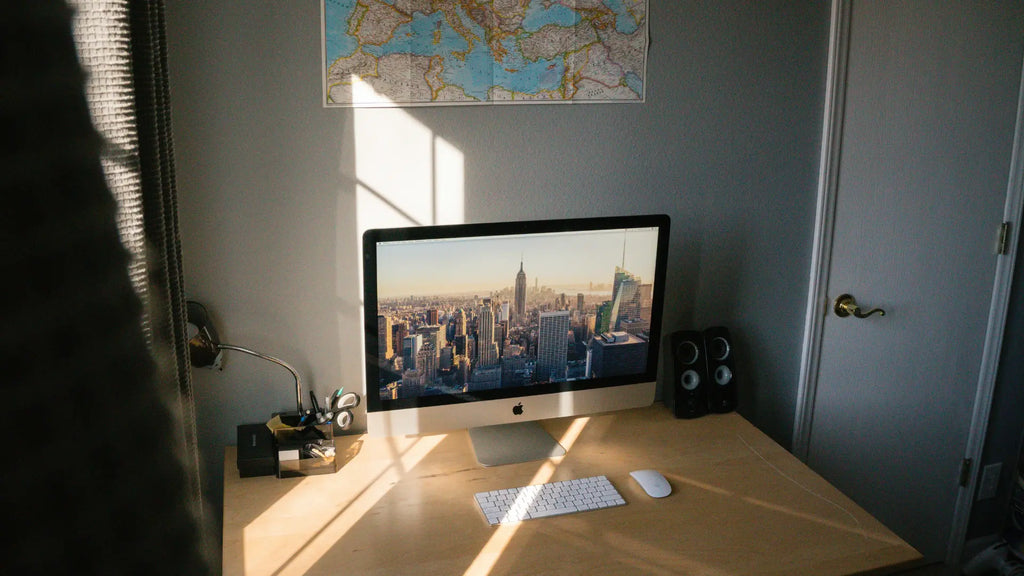 working desk with magic mouse and keyboard