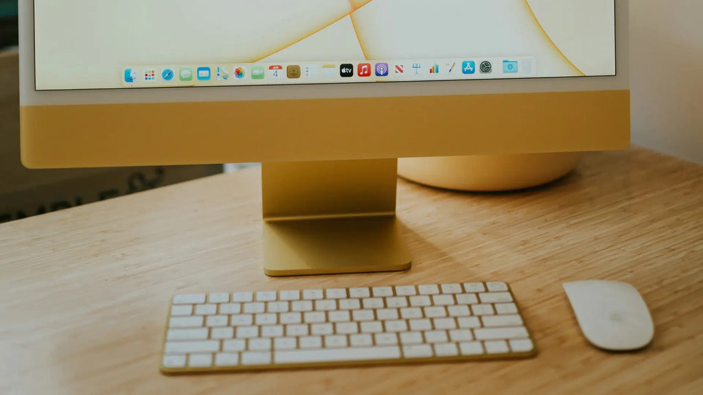 Yellow iMac with Magic Mouse and Magic Keyboard
