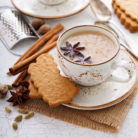 Chai with gingerbread cookies and cinnamon stick